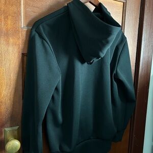 CDG Play Black zip hoodie.